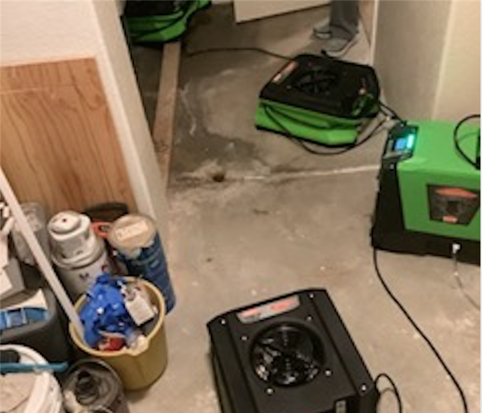 Green air movers on floor.